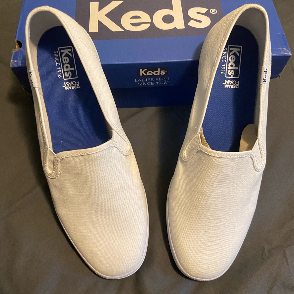 Keds Women’s white slip on sneaker.